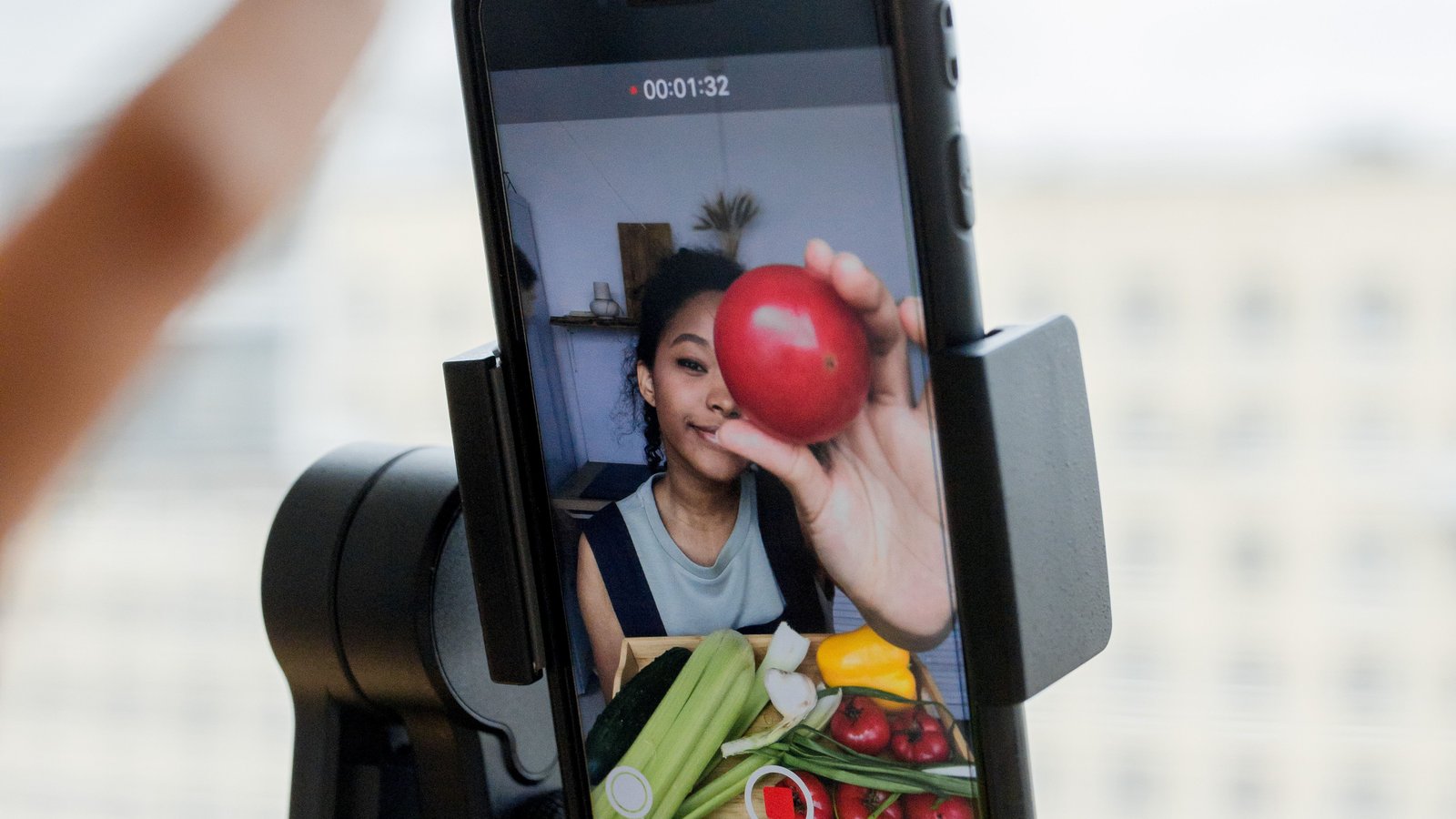 A phone on a gimbal recording vertical video, the kind of Reel an Instagram post-view ad now follows.
